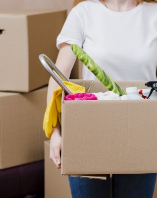 crop-woman-with-box-with-things